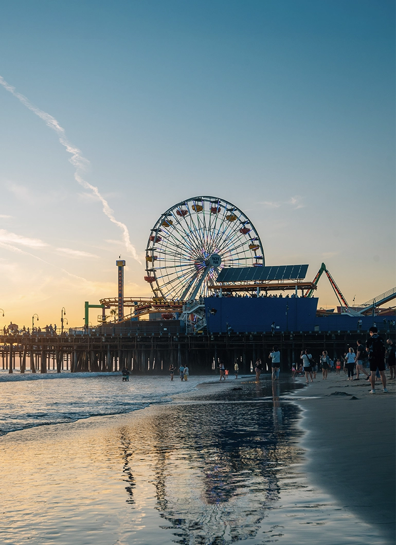 Santa Monica Pier at sunset featured on Performance Brokerage Services NADC conference page.