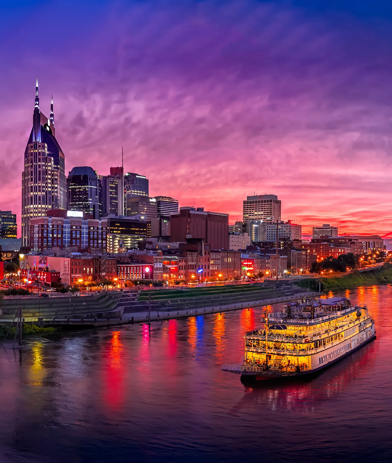 Nashville skyline at sunset along the Cumberland River, host city for the AICPA Dealership Conference.